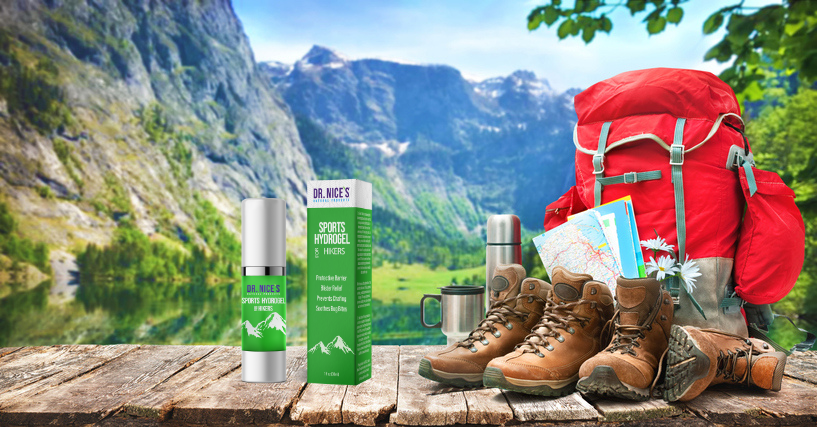 Tube of Dr. Nice's Sports Hydrogel for Hikers beside hiking boots and a map on a wooden surface