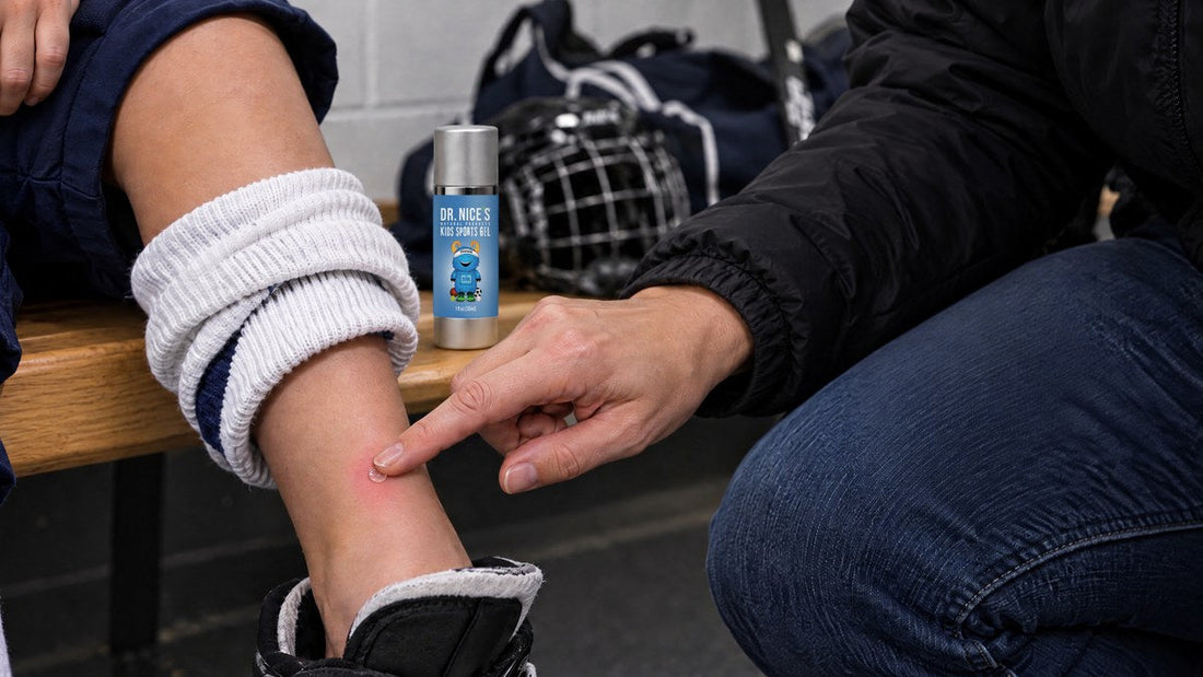 Parent dabbing one clear dot of Dr. Nice's Kids Sports Gel on a pink rubbed spot above a young hockey player's skate